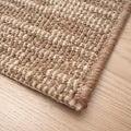 beige kumipohjainen käytävämatto aatos lähikuva